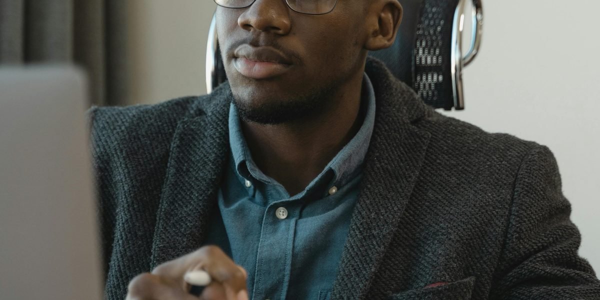 A person thoughtfully considering their next career move, reflecting the initial challenge of job searching.